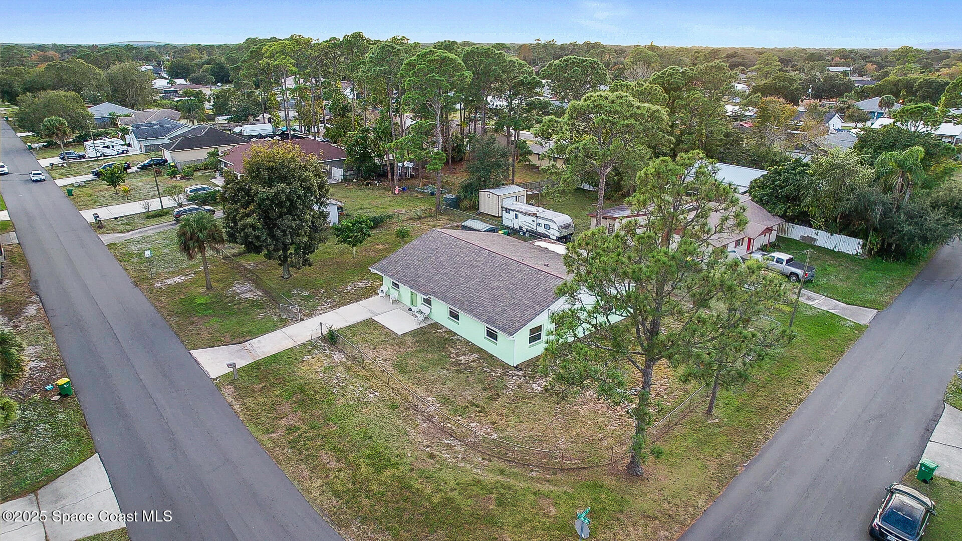 6450 Ember Avenue Cocoa, FL 32927 - Photo 3 of 40 an aerial view of residential houses with outdoor space
