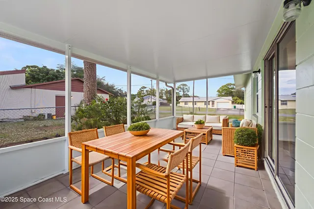 a view of a backyard with large trees