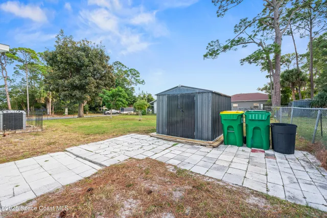 a big house with trees in front of it