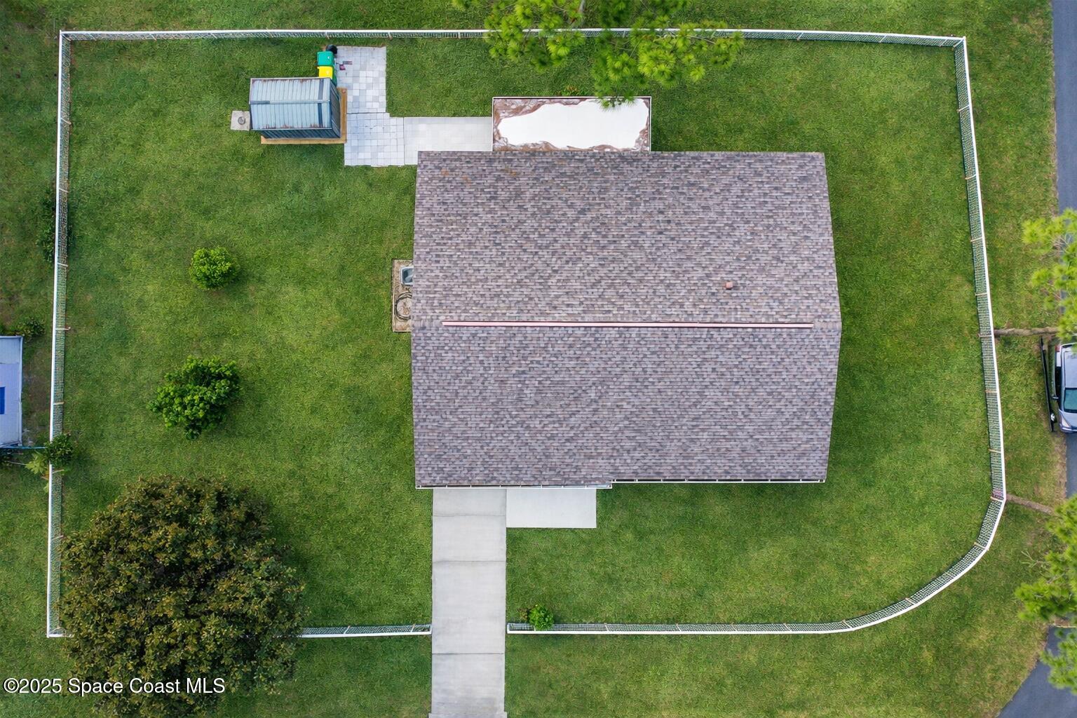 6450 Ember Avenue Cocoa, FL 32927 - Photo 38 of 40 a view of a house with a backyard space and garden