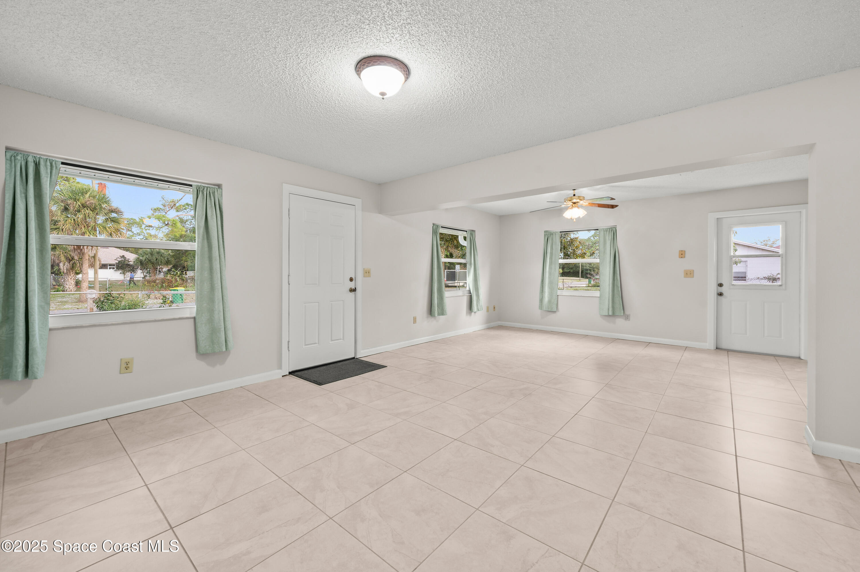6450 Ember Avenue Cocoa, FL 32927 - Photo 5 of 40 a view of an empty room with a window