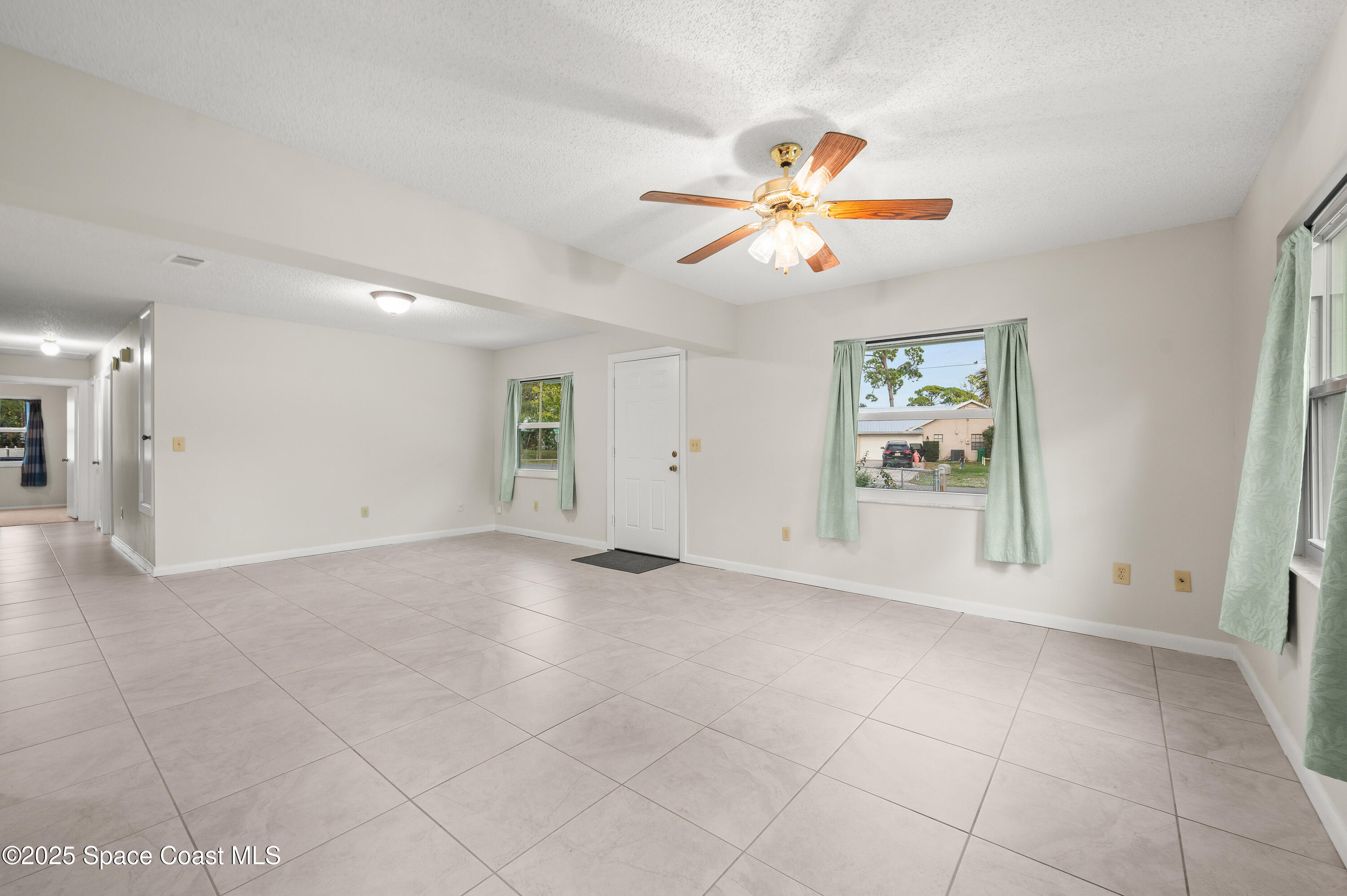 6450 Ember Avenue Cocoa, FL 32927 - Photo 6 of 40 a view of an empty room with a window