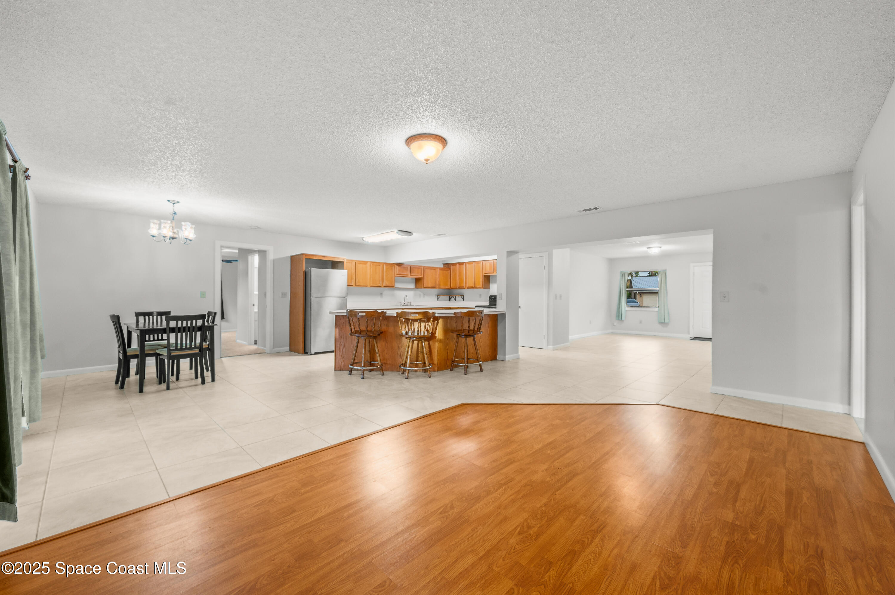6450 Ember Avenue Cocoa, FL 32927 - Photo 10 of 40 a view of a livingroom with furniture and a flat screen tv