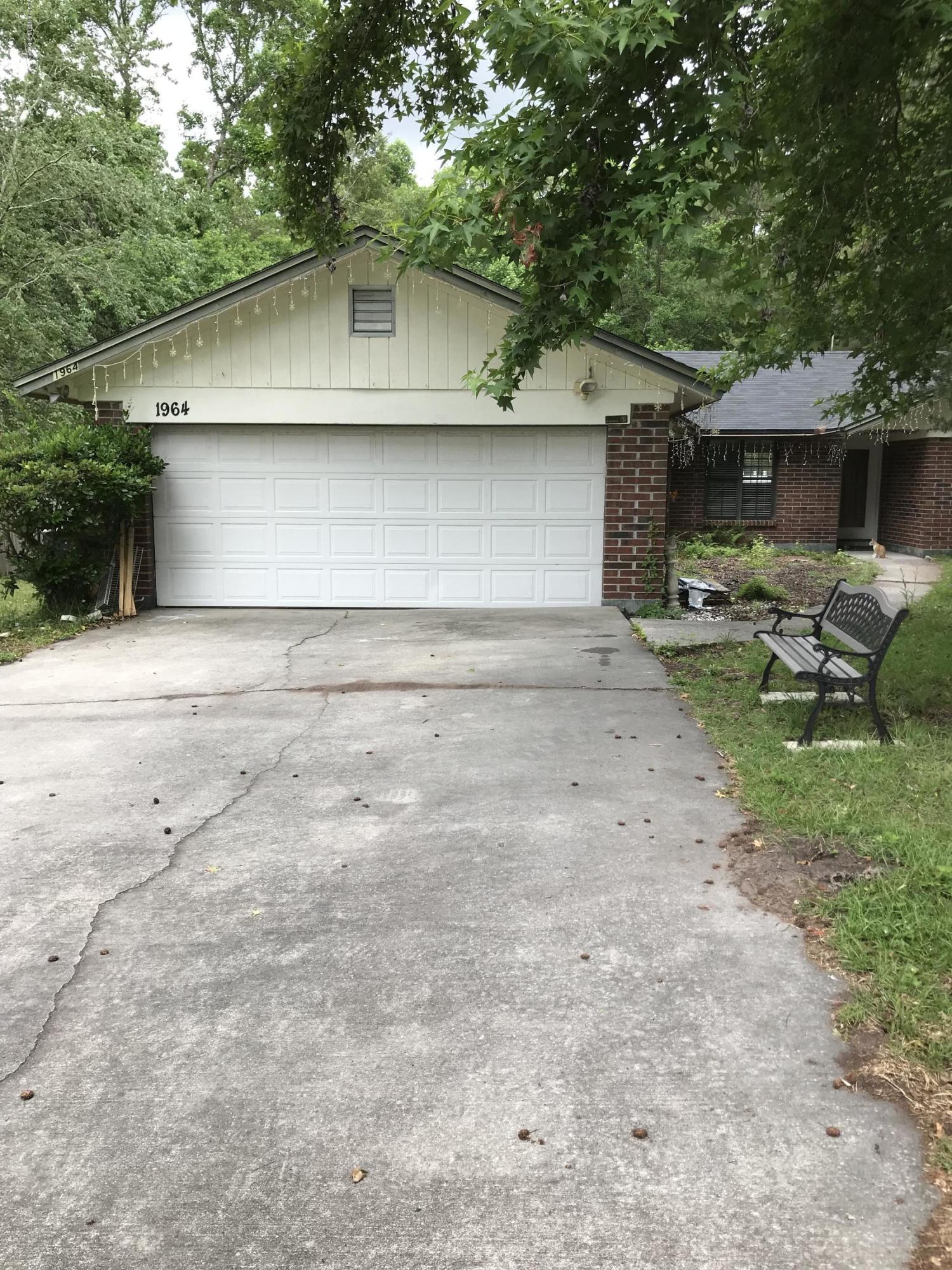 1964 Rothbury Drive Jacksonville, FL 32221 - Photo 1 of 1 a front view of a house with garden