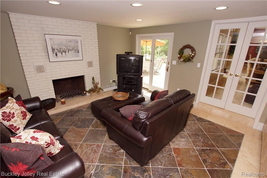 11631 Ridge Road South Lyon, MI 48178 - Photo 17 of 40 Family Room has a Cozy Natural Fireplace