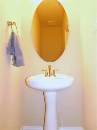 a bathroom with a sink and mirror