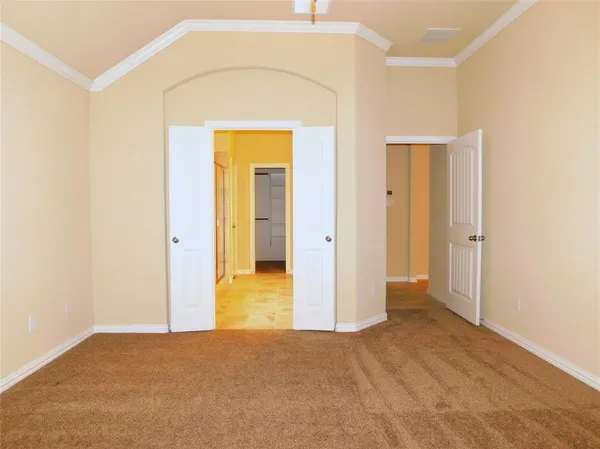 a view of an empty room with a bathroom