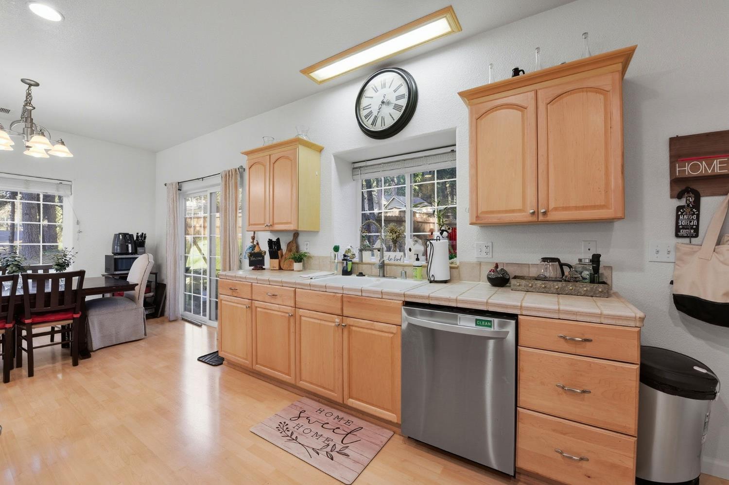 2845 Viona Road Pollock Pines, CA 95726 - Photo 15 of 35 a kitchen with a cabinets and a clock on the wall