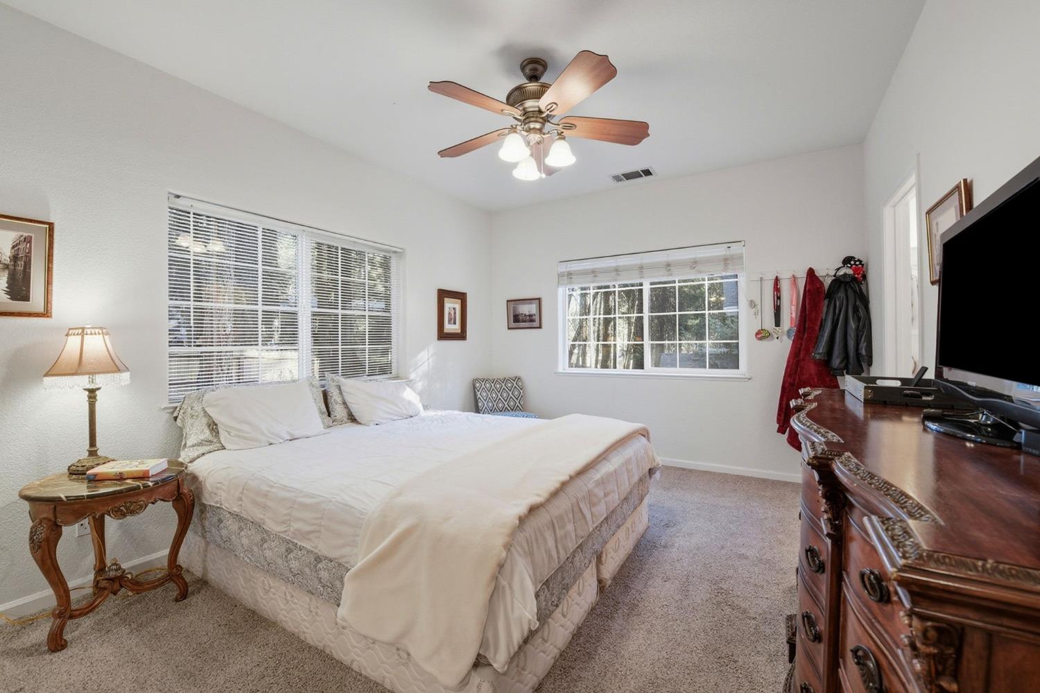 2845 Viona Road Pollock Pines, CA 95726 - Photo 17 of 35 a bedroom with a bed and a flat screen tv