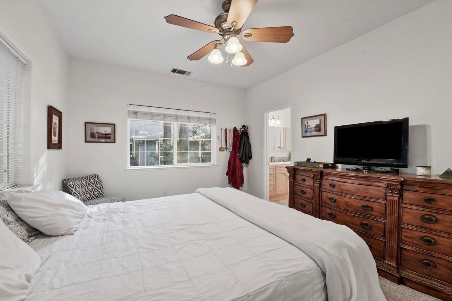 2845 Viona Road Pollock Pines, CA 95726 - Photo 18 of 35 a bedroom with a bed and a flat screen tv