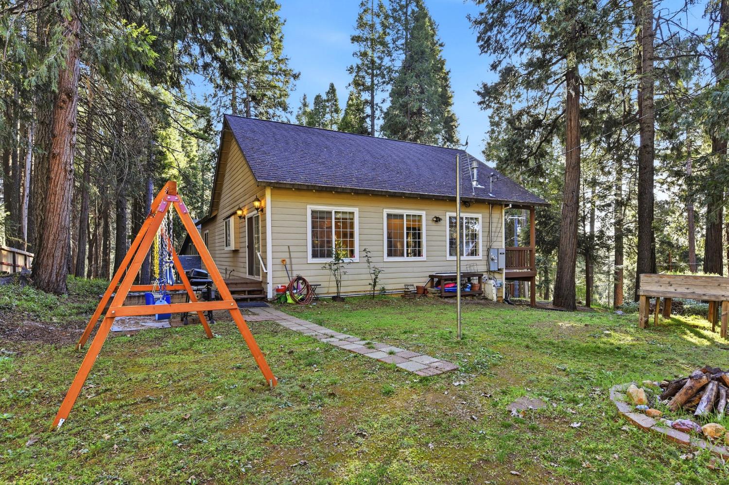 2845 Viona Road Pollock Pines, CA 95726 - Photo 27 of 32 a view of a house with a big yard and sitting area