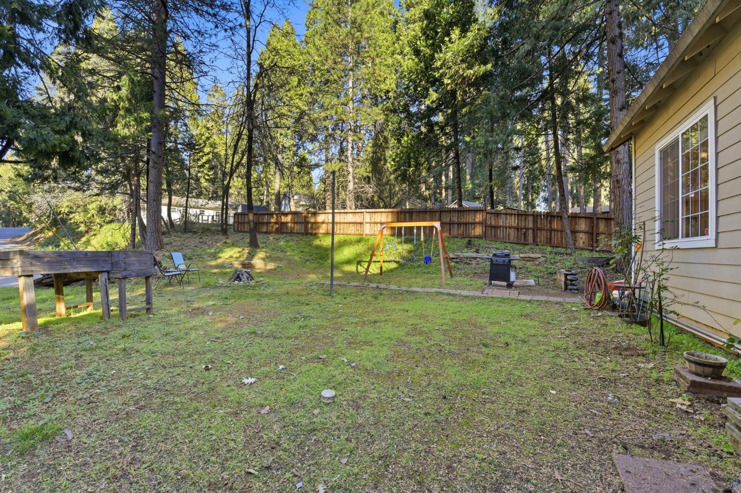 2845 Viona Road Pollock Pines, CA 95726 - Photo 30 of 32 a view of backyard with a table and chairs