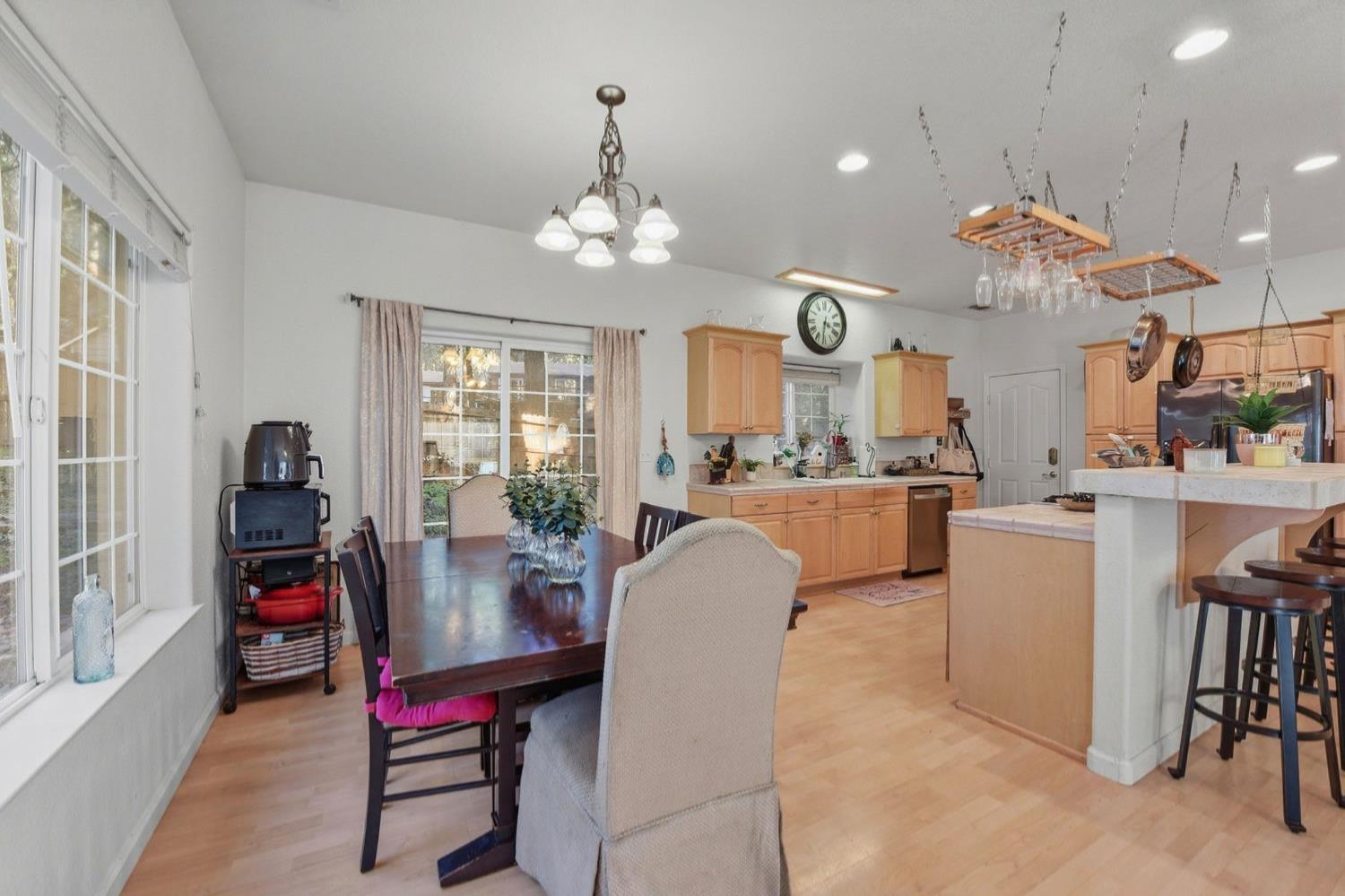 2845 Viona Road Pollock Pines, CA 95726 - Photo 10 of 32 a view of a dining room with furniture and chandelier