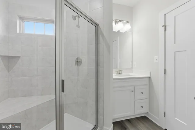 a bathroom with a shower and a mirror
