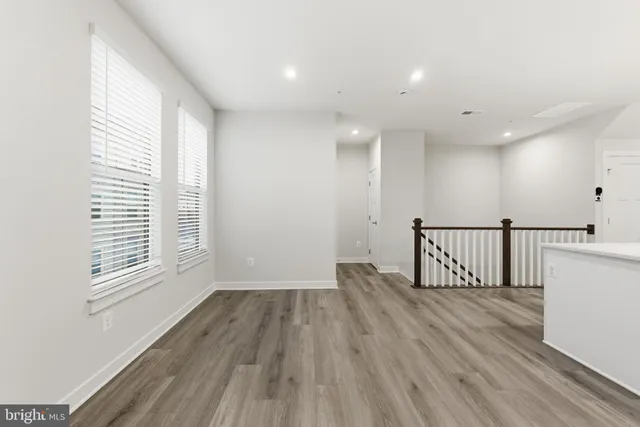 a view of a livingroom with wooden floor