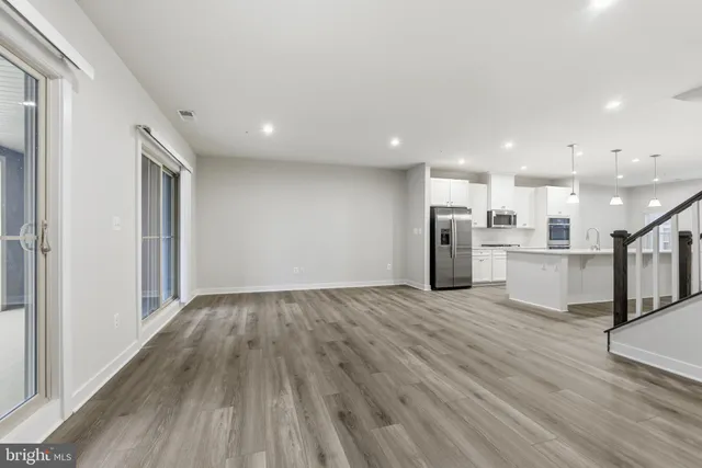 a view of kitchen with wooden floor