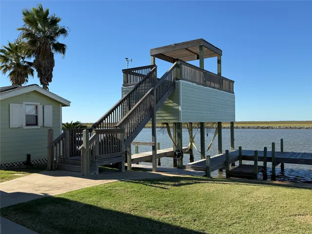 a view of a house with swimming pool and porch