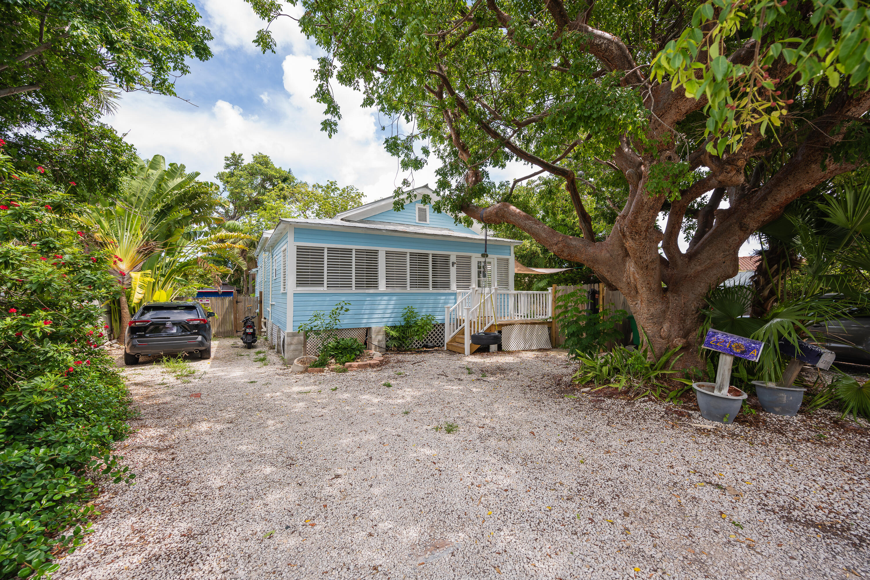 2210 Staples Avenue Key West, FL 33040 - Photo 22 of 33 a view of a house with a yard and sitting area