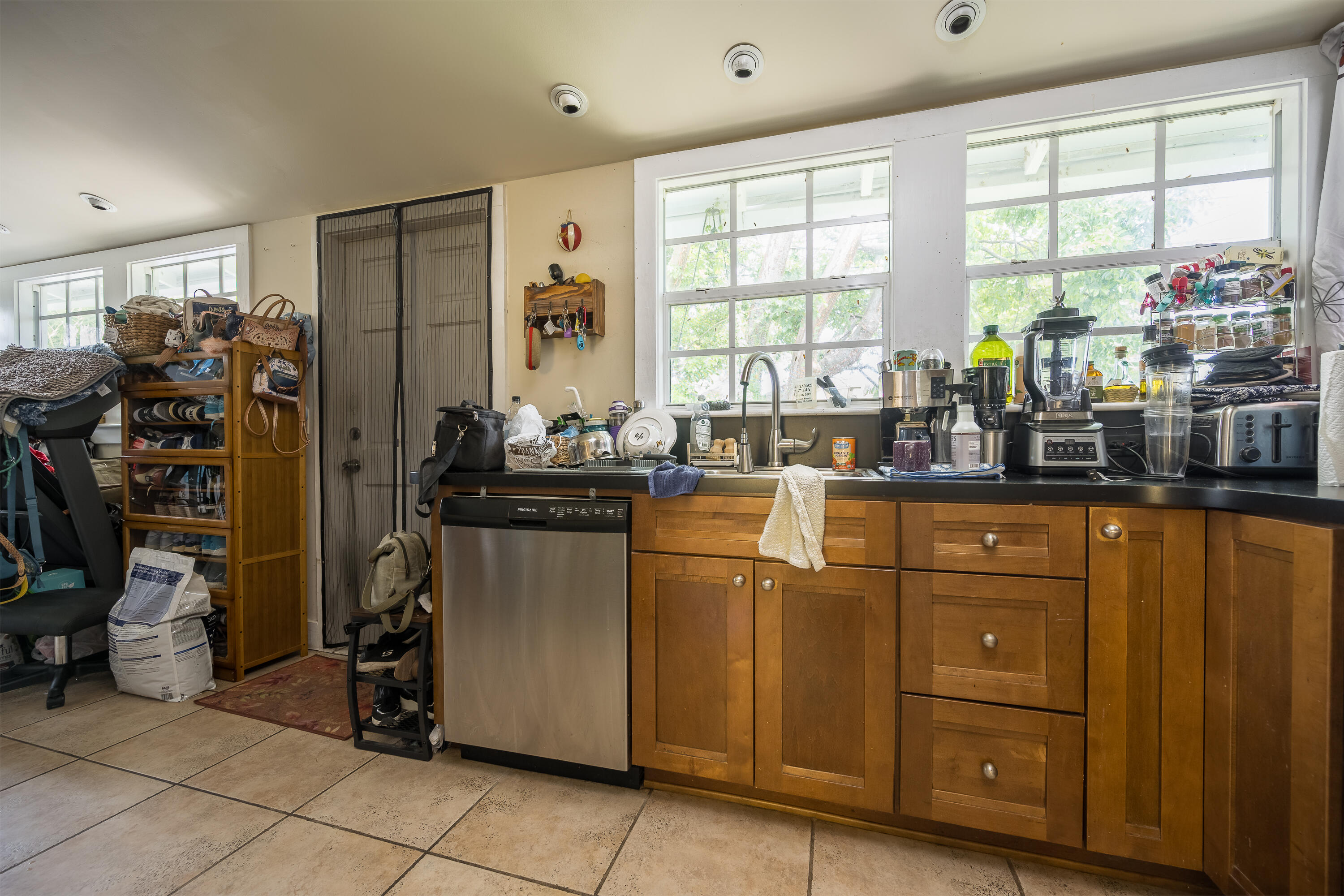 2210 Staples Avenue Key West, FL 33040 - Photo 24 of 33 a kitchen with sink a refrigerator and window