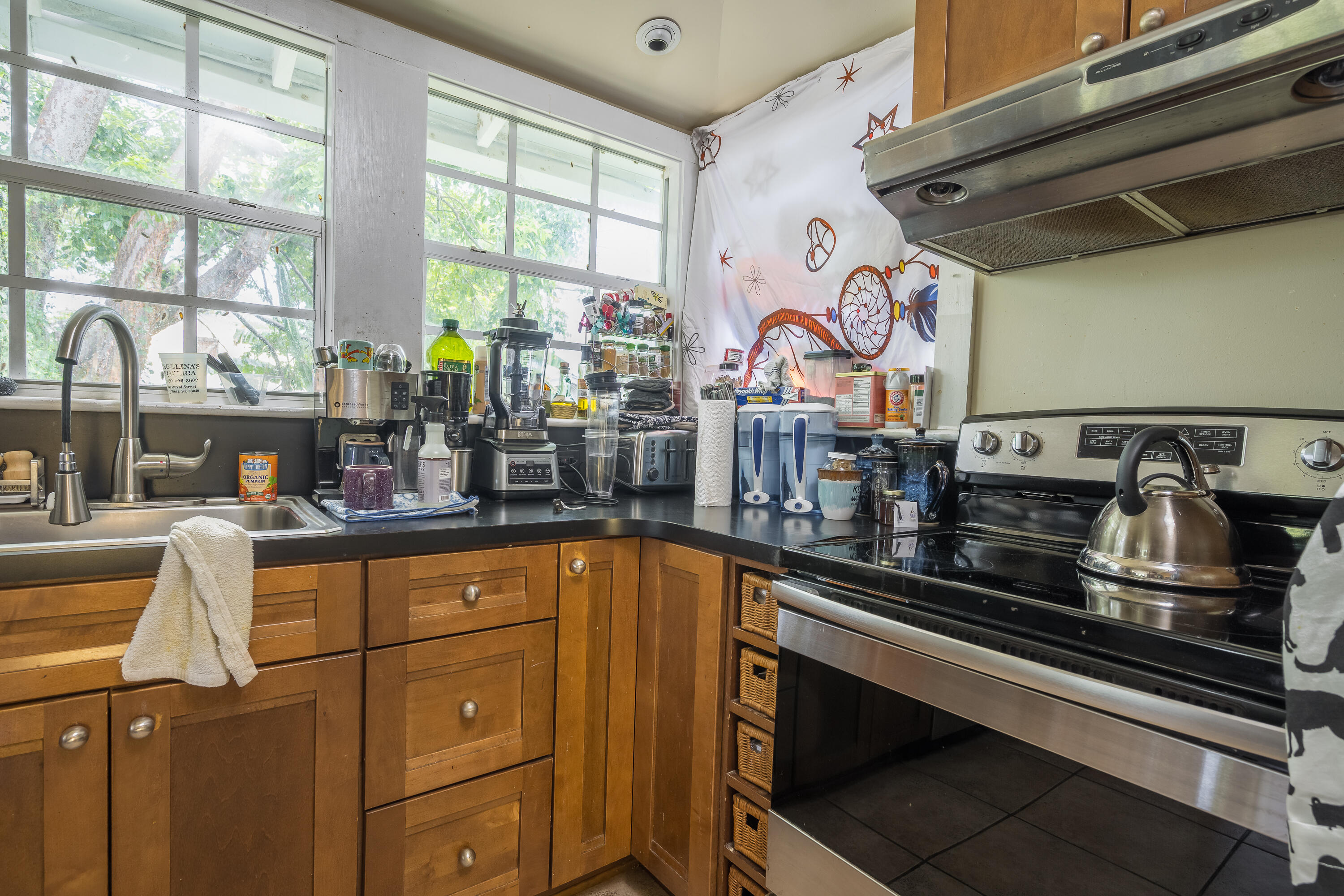 2210 Staples Avenue Key West, FL 33040 - Photo 28 of 33 a kitchen with stainless steel appliances granite countertop a sink and a stove