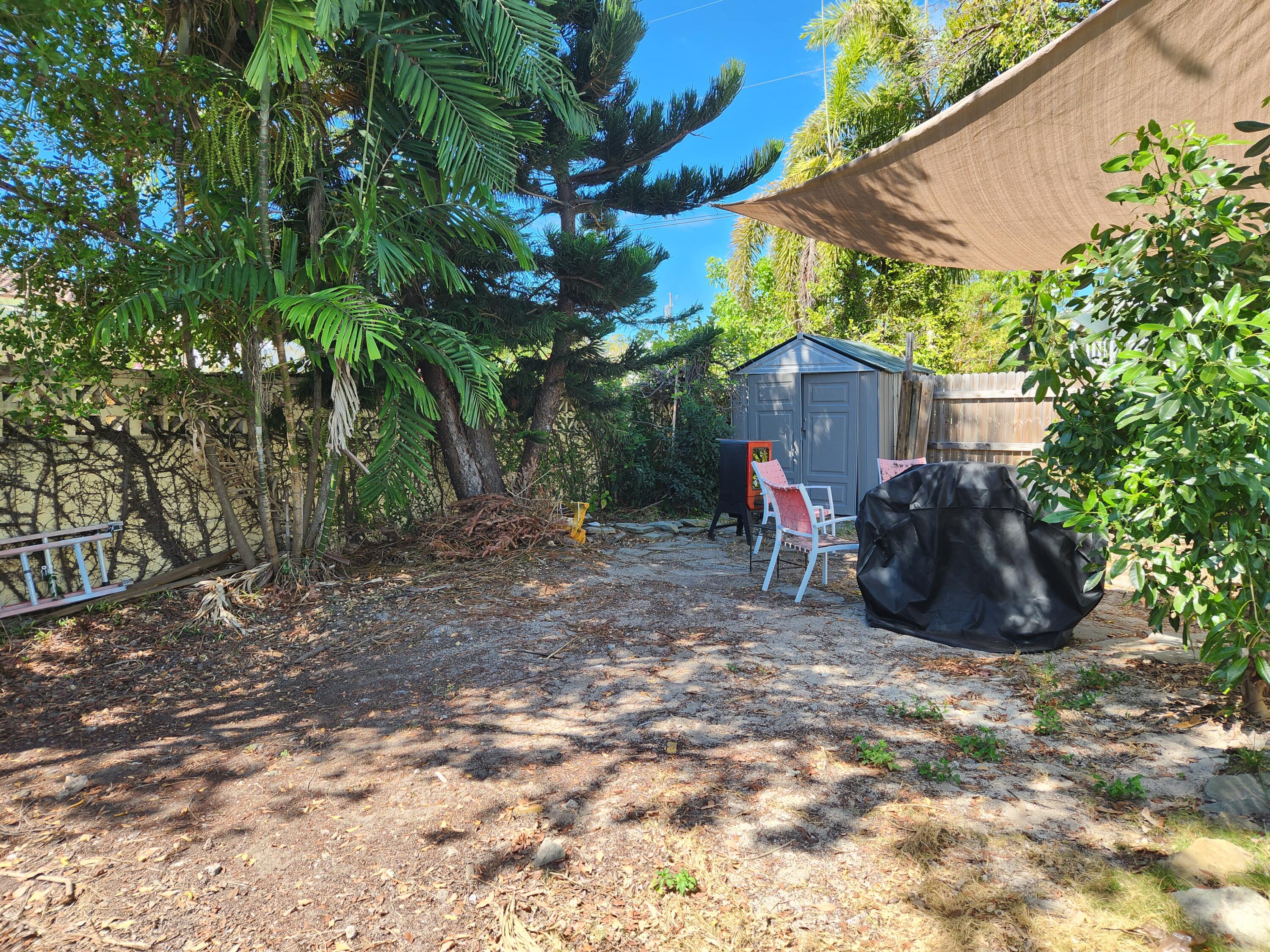 2210 Staples Avenue Key West, FL 33040 - Photo 3 of 33 a view of a chairs and table in the backyard