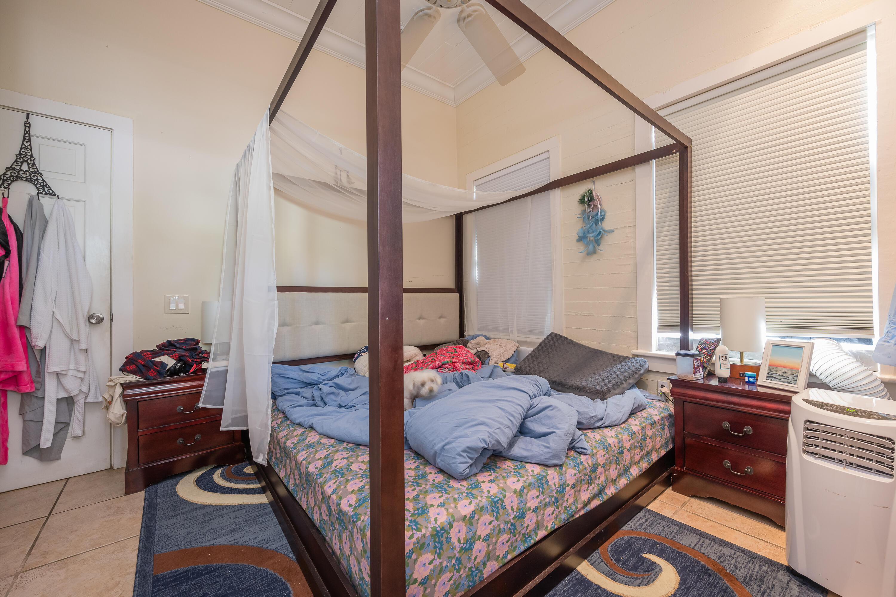 2210 Staples Avenue Key West, FL 33040 - Photo 31 of 33 a bedroom with a bed and a window