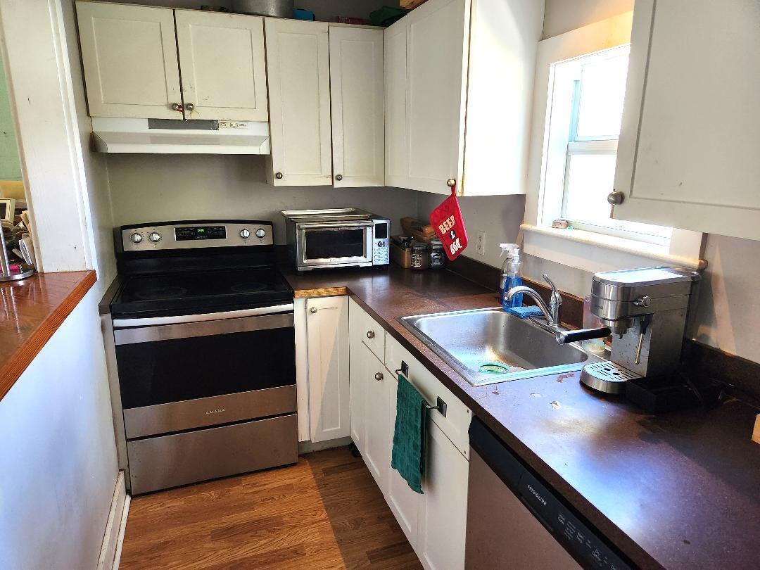 2210 Staples Avenue Key West, FL 33040 - Photo 7 of 33 a kitchen with a stove and a sink