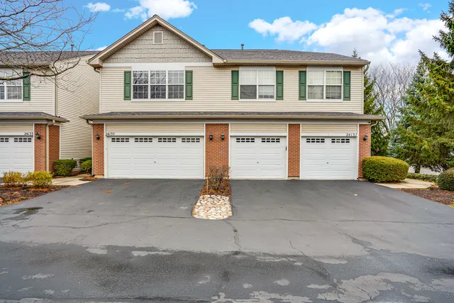 a view of a house with a street