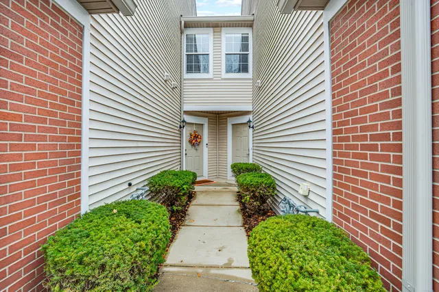 a view of a pathway besides a house
