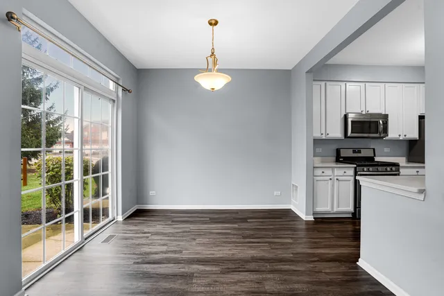 a view of cabinets and wooden floor