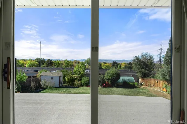 a view of a porch with a garden