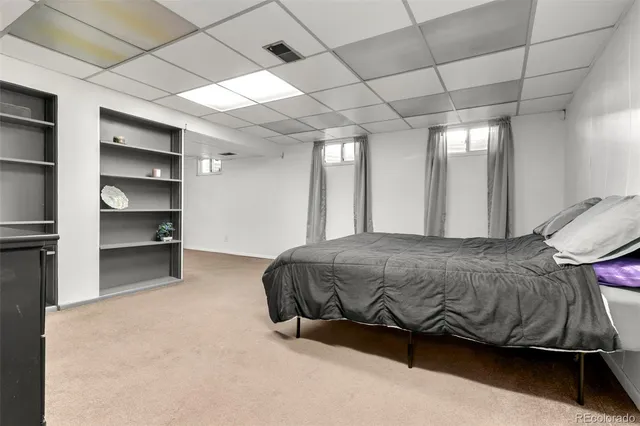 a bedroom with a bed and a walk in closet