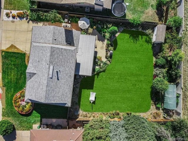 an aerial view of house with yard