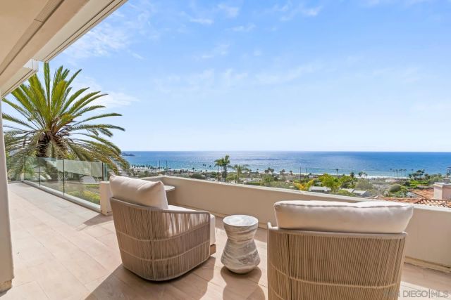 a view of a hallway with closet and wooden floor