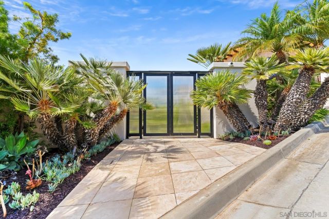 a living room with couch and a large window
