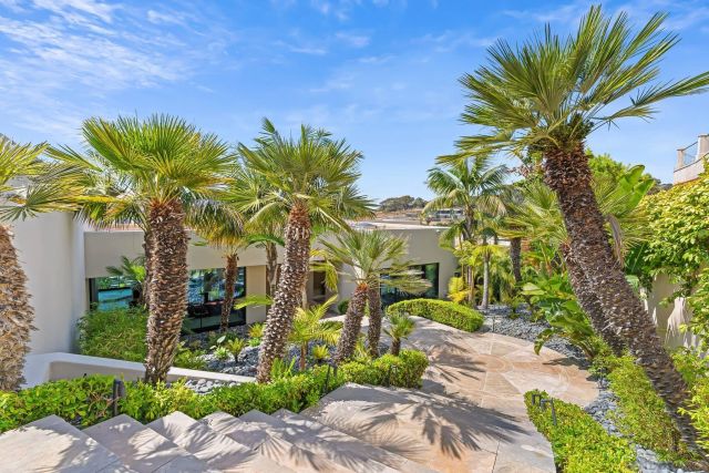 a living room filled with furniture and a large window