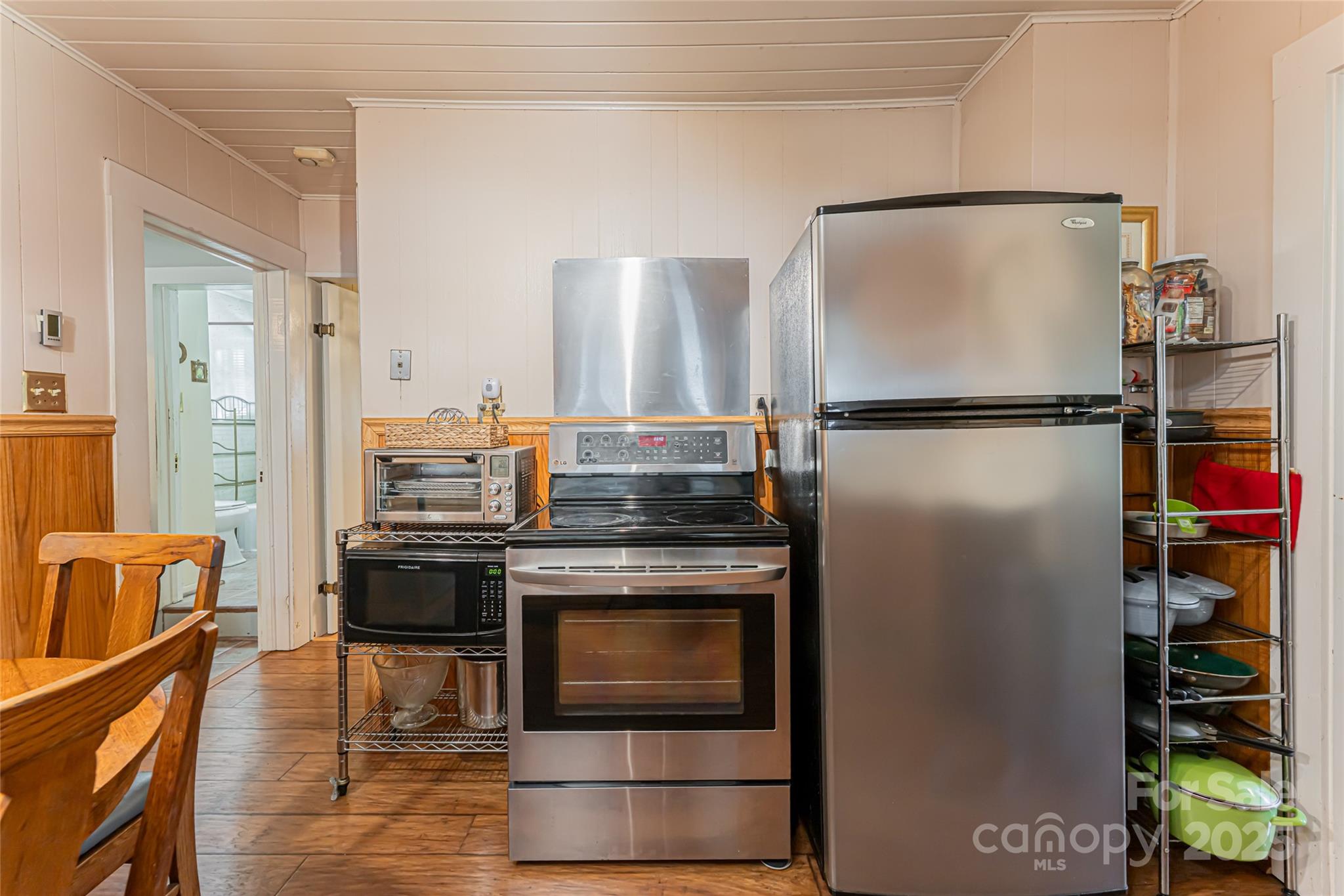 338 Morgan Road Candler, NC 28715 - Photo 15 of 42 a kitchen with stainless steel appliances granite countertop a refrigerator and a stove top oven