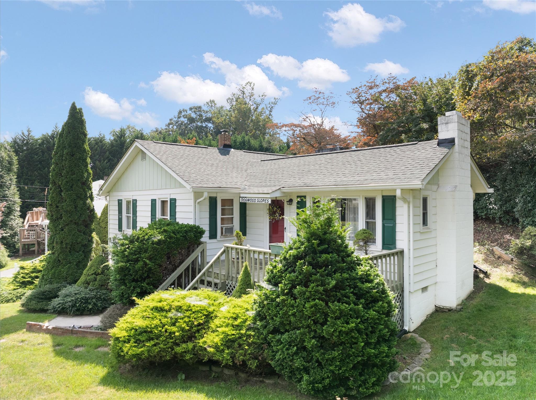 338 Morgan Road Candler, NC 28715 - Photo 2 of 42 a front view of a house with a yard