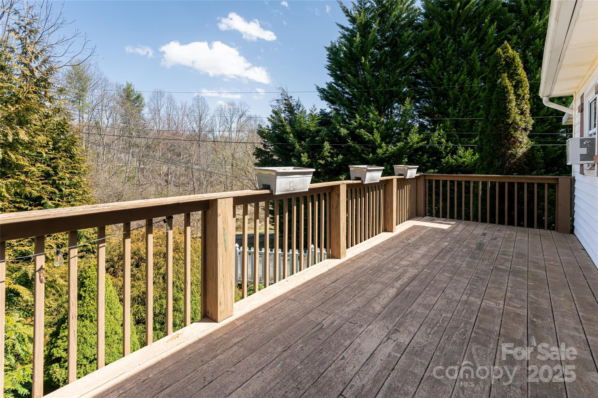 338 Morgan Road Candler, NC 28715 - Photo 29 of 42 a view of a wooden roof deck
