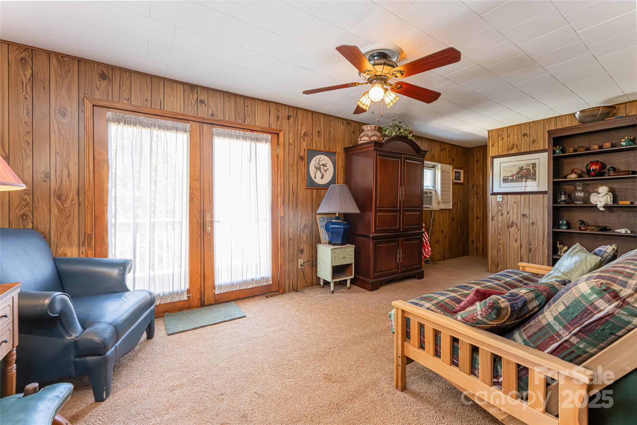 338 Morgan Road Candler, NC 28715 - Photo 31 of 42 a living room with furniture and a ceiling fan