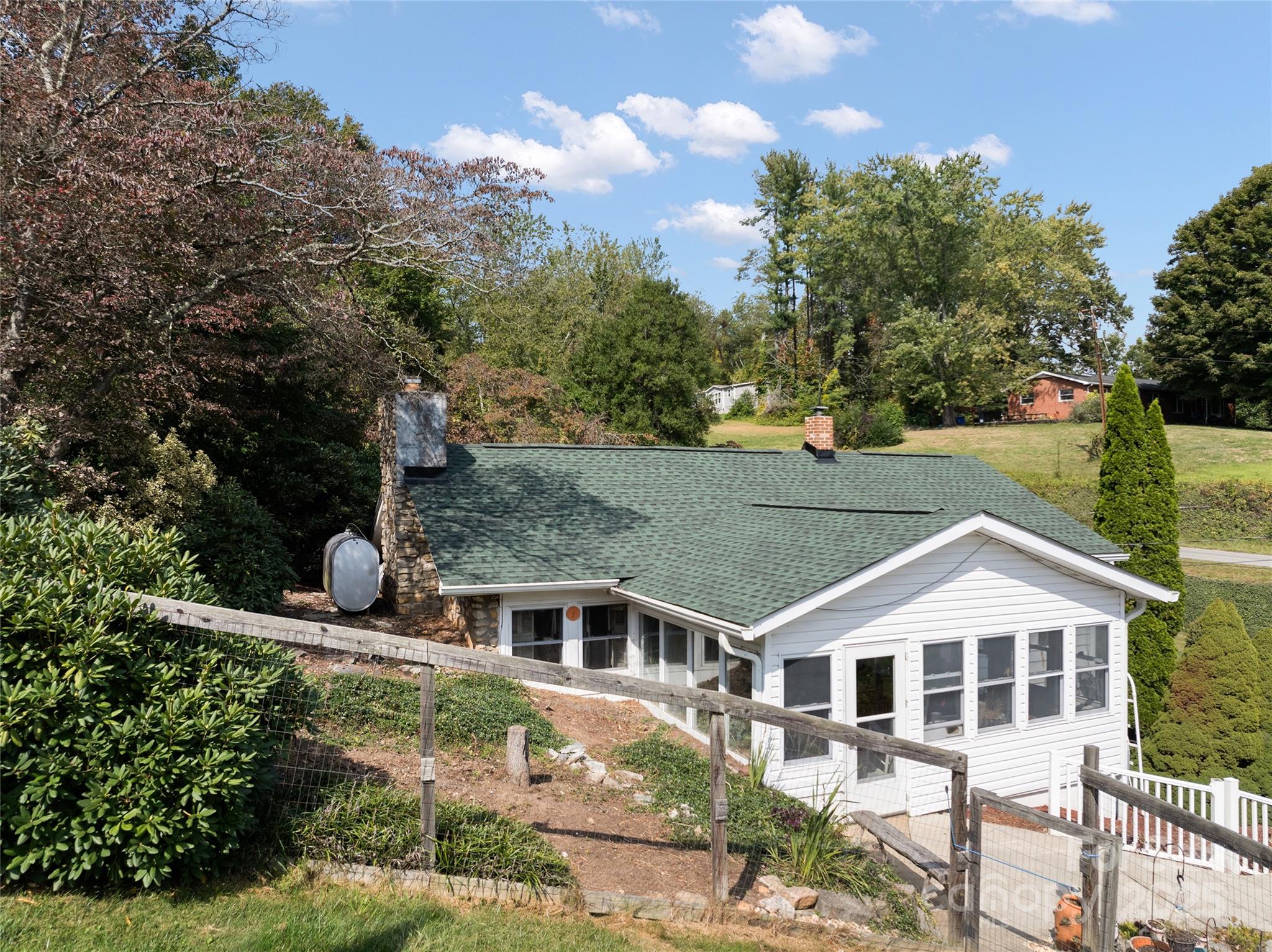 338 Morgan Road Candler, NC 28715 - Photo 37 of 42 an aerial view of a house with a yard