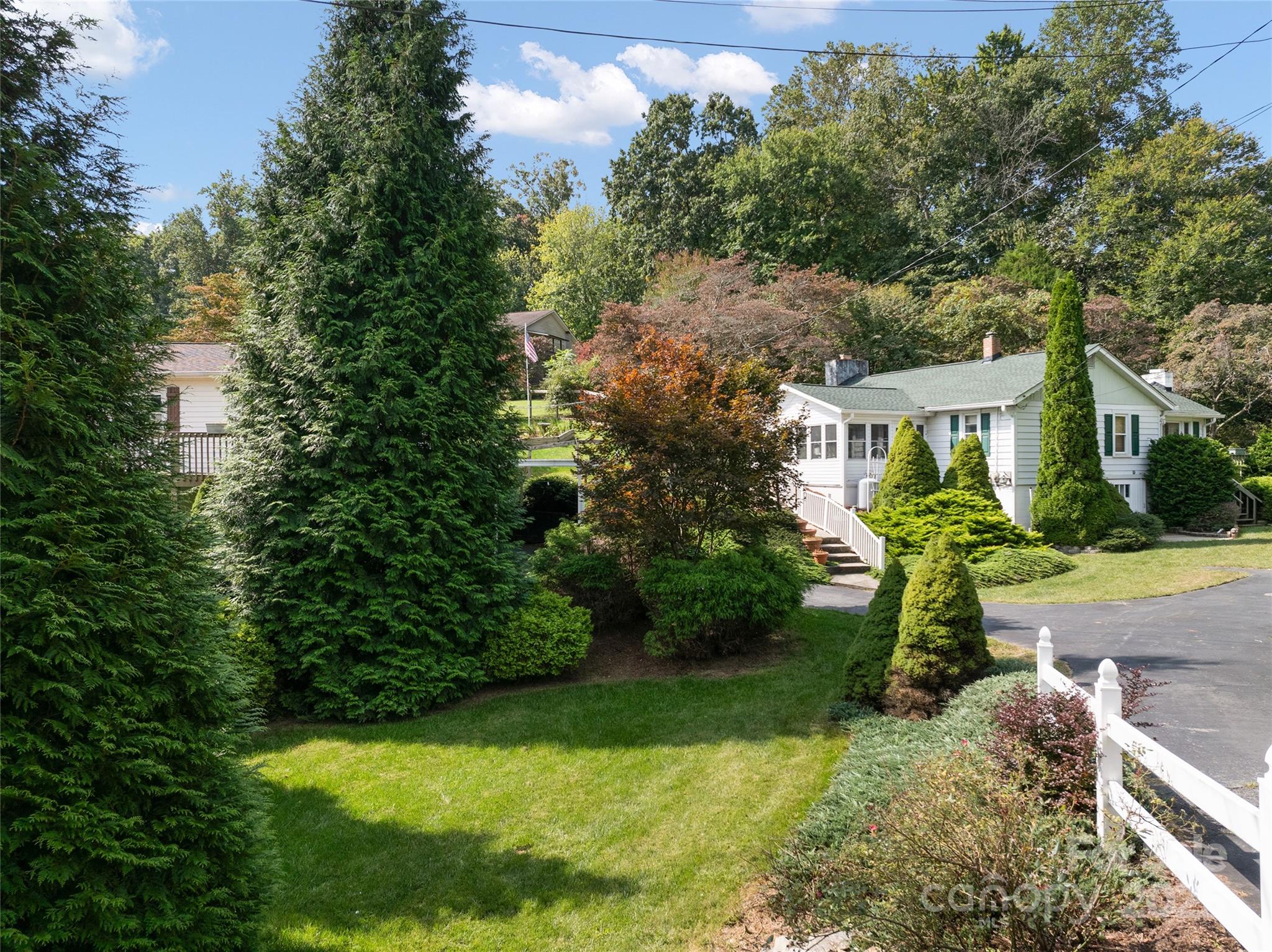 338 Morgan Road Candler, NC 28715 - Photo 39 of 42 a view of yard with swimming pool and green space