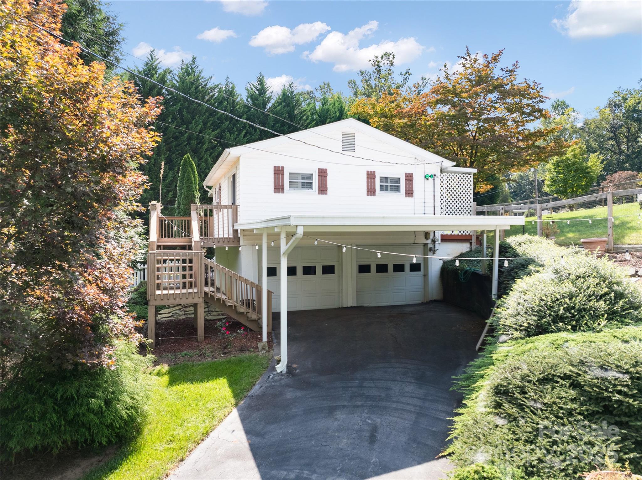 338 Morgan Road Candler, NC 28715 - Photo 5 of 42 a view of a house with backyard and sitting area