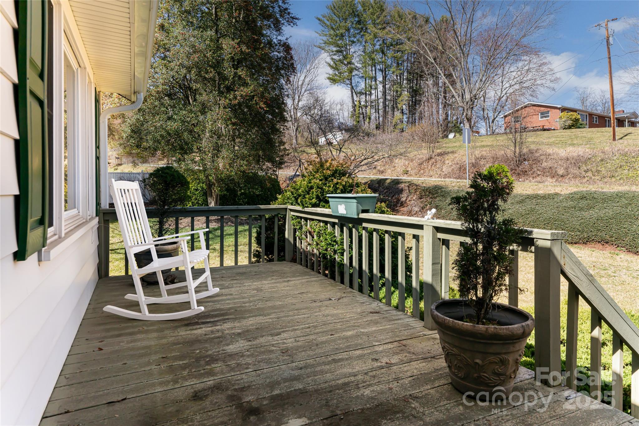 338 Morgan Road Candler, NC 28715 - Photo 7 of 42 a view of a chairs and table on the balcony