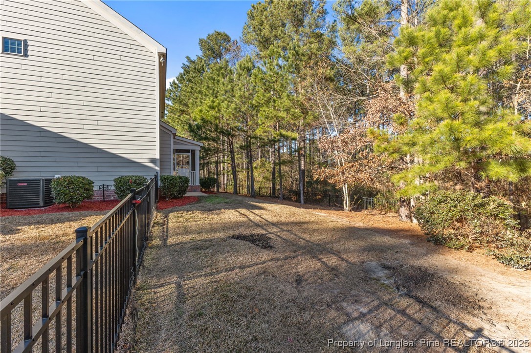 419 Rolling Pines Drive Spring Lake, NC 28390 - Photo 23 of 31 a view of a backyard with pathway