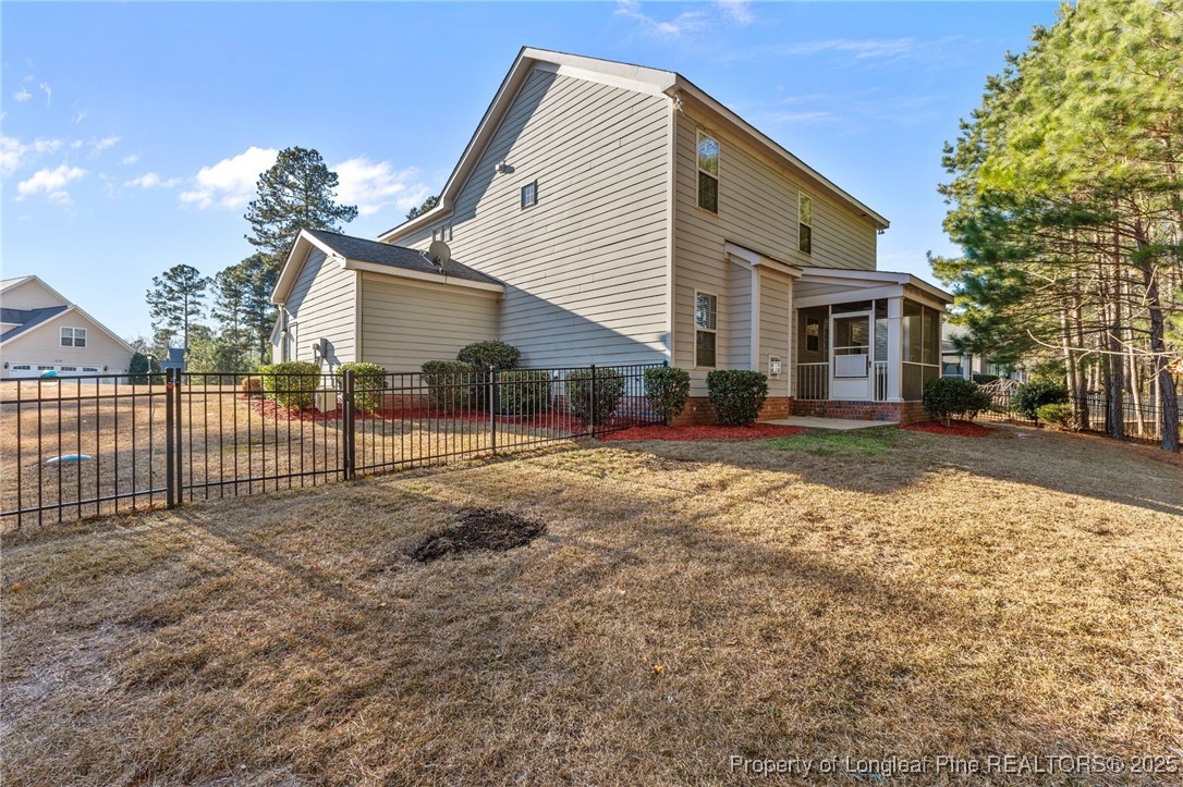 419 Rolling Pines Drive Spring Lake, NC 28390 - Photo 29 of 31 a view of a house with a yard