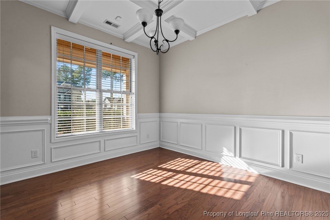 419 Rolling Pines Drive Spring Lake, NC 28390 - Photo 4 of 31 a view of empty room with wooden floor and fan