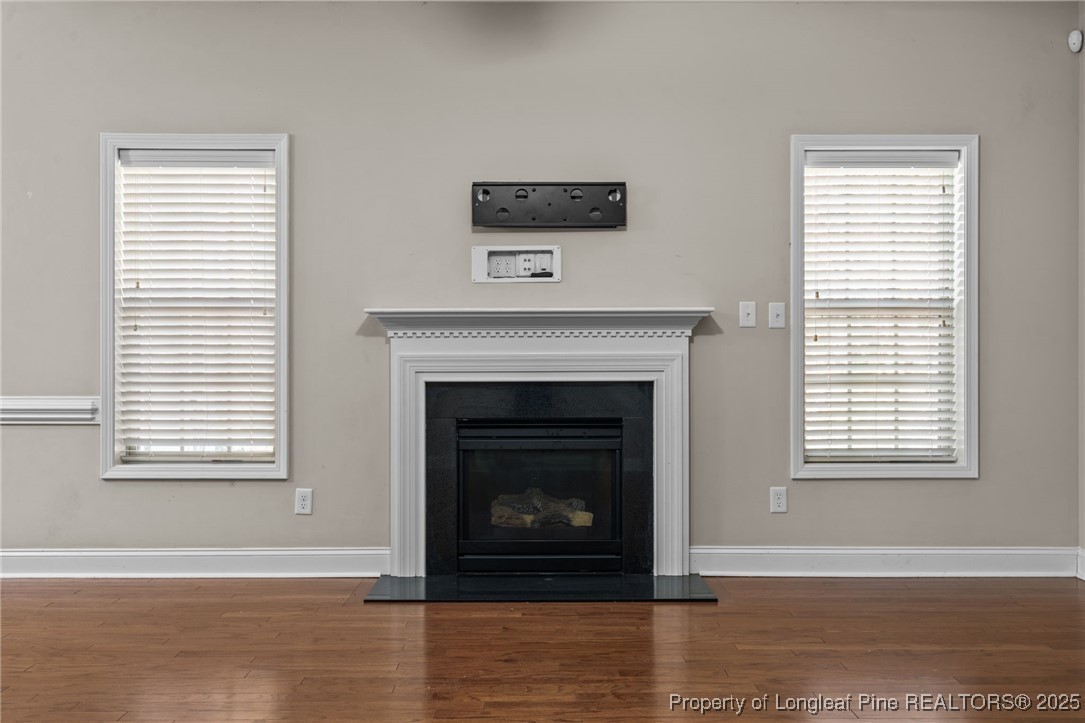 419 Rolling Pines Drive Spring Lake, NC 28390 - Photo 9 of 31 a living room with a fireplace and a window