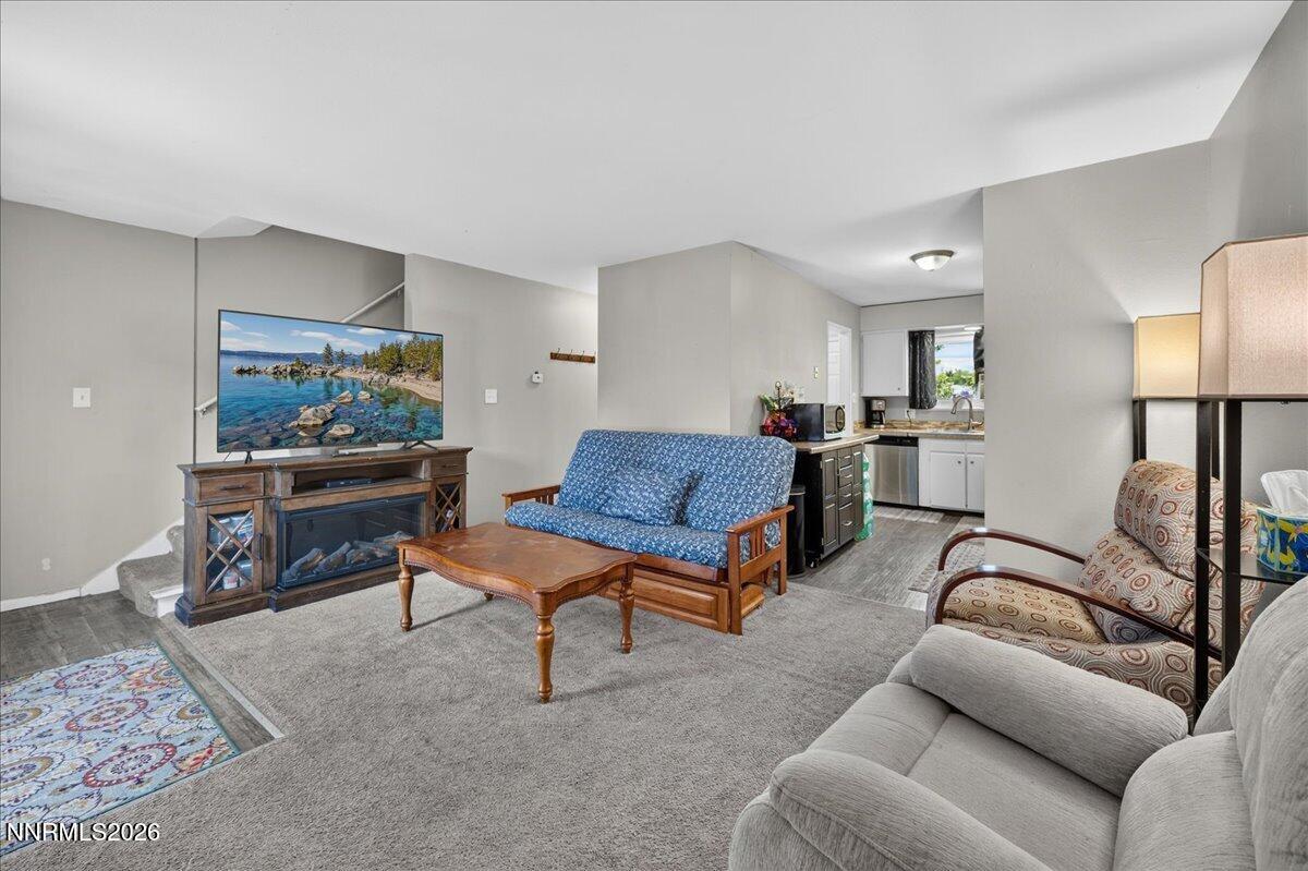 5 Smithridge Park Reno, NV 89502 - Photo 5 of 24 a living room with furniture and a lamp