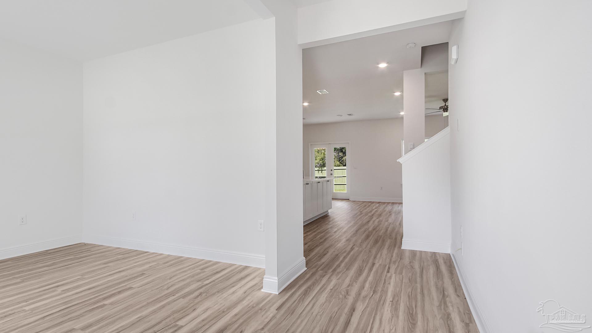 3233 Harrier Road Pace, FL 32571 - Photo 8 of 50 a view of a room with wooden floor